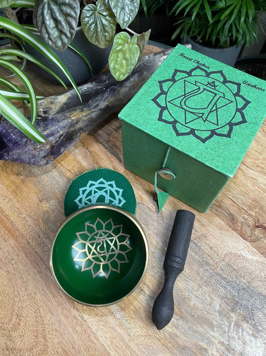Pictured is a small metal singing bowl with a pillow and a wood gong mallet. Green Singing Bowl (Heart Chakra) 8cm