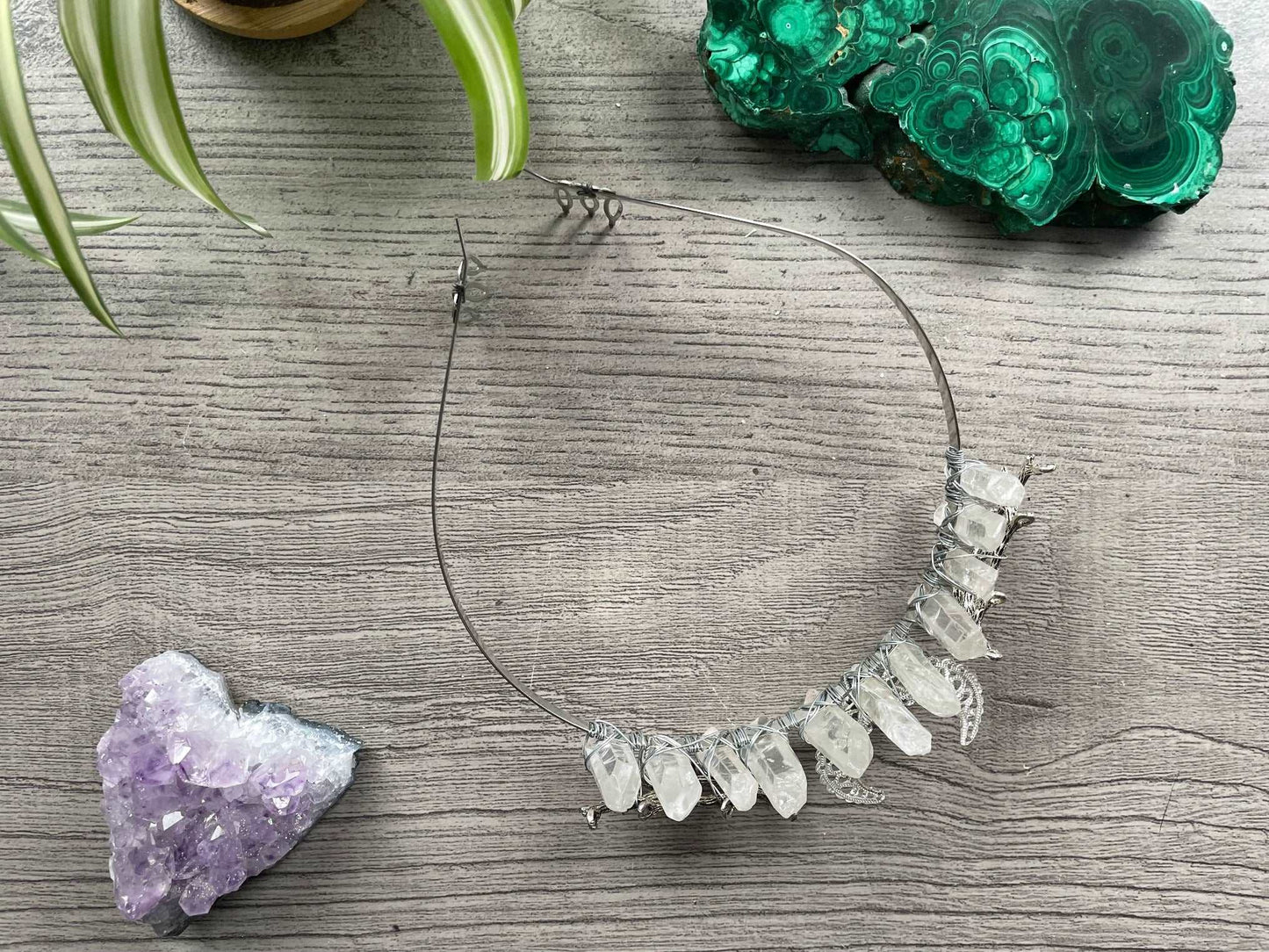 Pictured is a crown made with clear quartz points and a silver crescent moon.Clear Quartz Aura Crystal Crown - The Wandering Fox Emporium, Your Crystal Store top