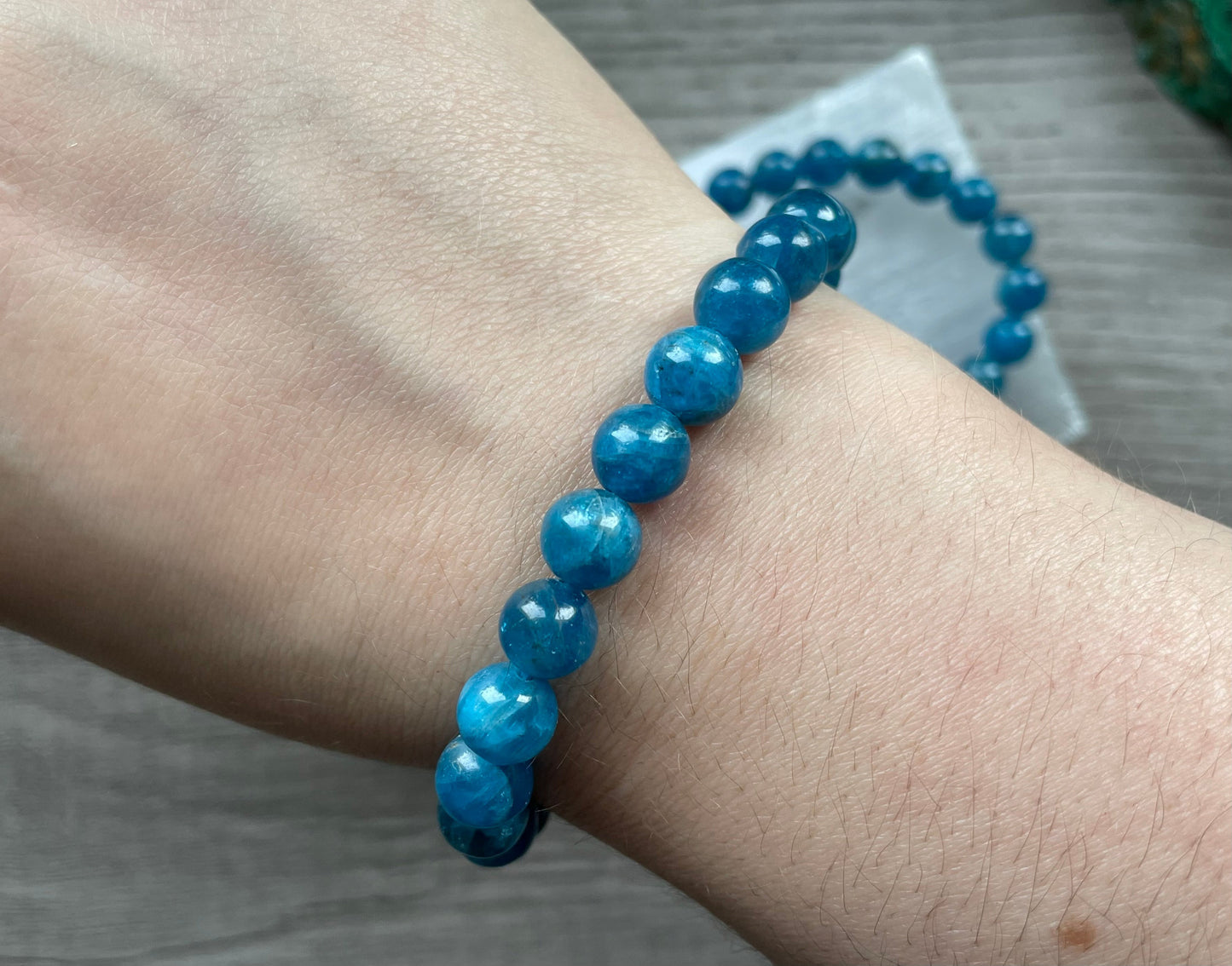 Pictured is a blue apatite bead bracelet.