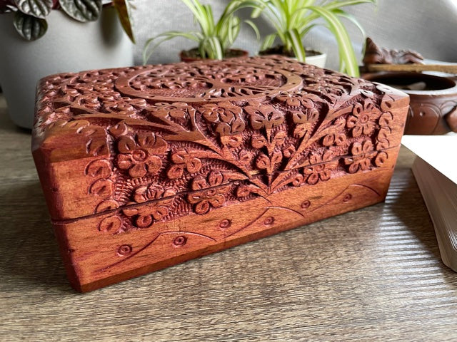 Pictured is hand-carved wood box with a tree of life in the middle. Tree of Life Large Carved Wooden Box front