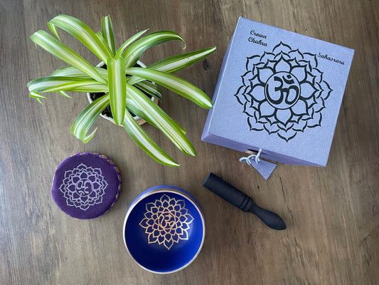 Pictured is a small metal singing bowl with a pillow and a wood gong mallet. Purple Singing Bowl (Crown Chakra) 8cm top
