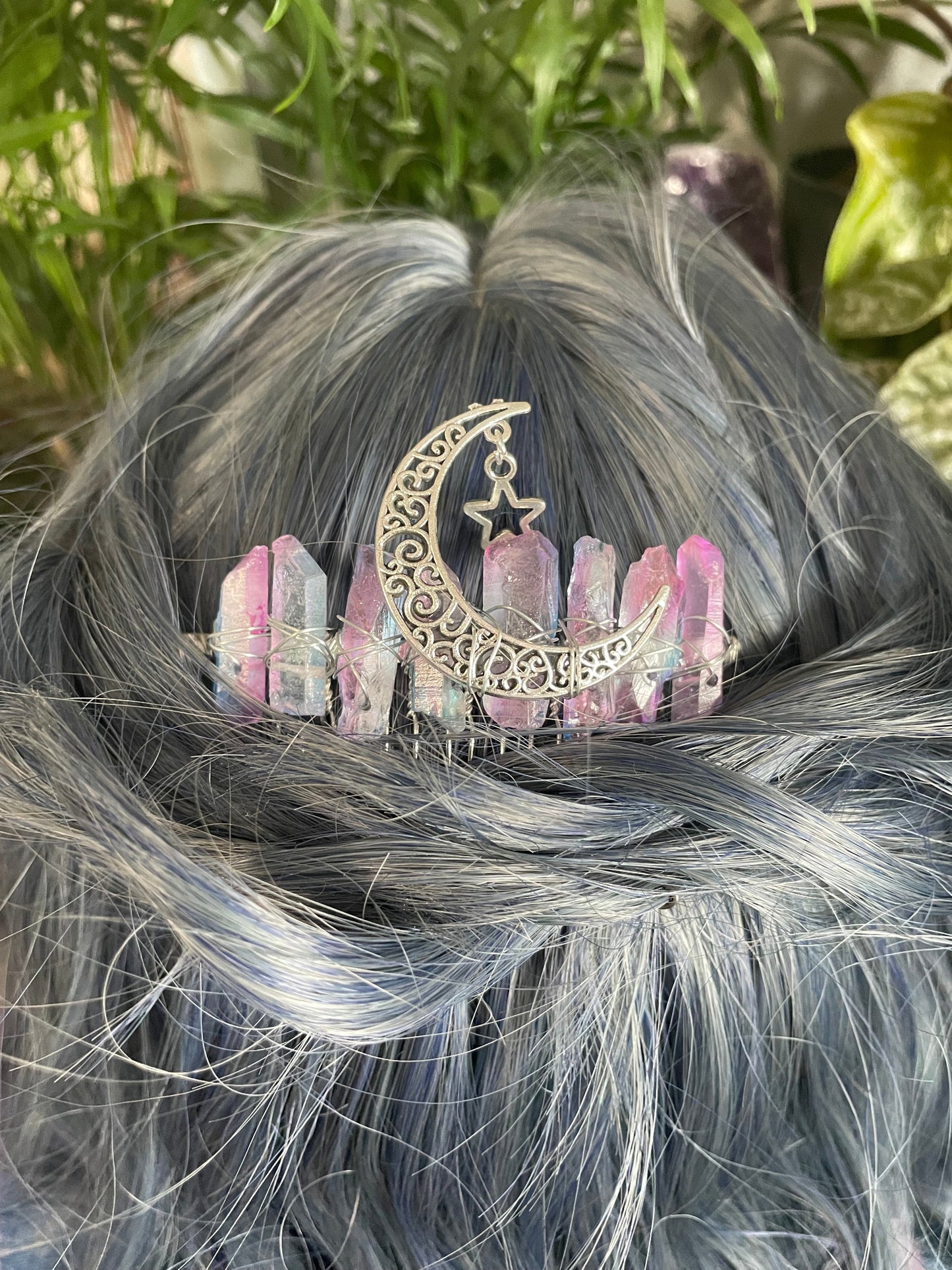 Pictured are various aura quartz hair combs with silver crescent moons on them. Pink & Blue Quartz Aura Crystal Comb - The Wandering Fox Emporium, Your Metaphysical Store example