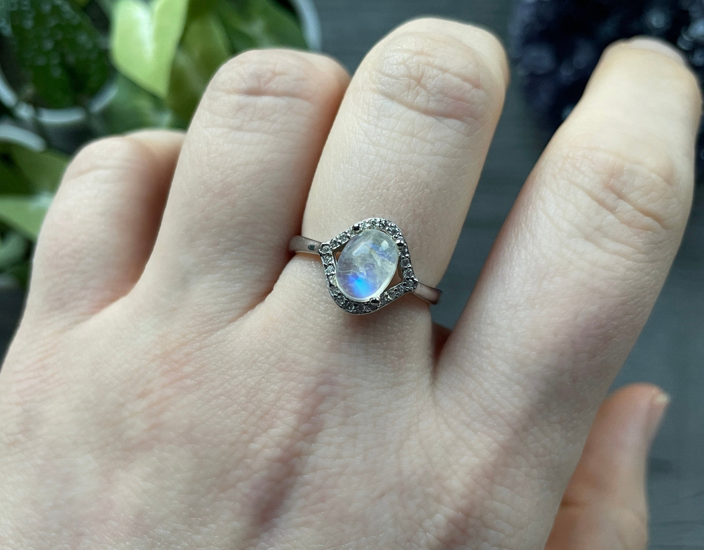 Pictured is a white moonstone gemstone set in an S925 sterling silver ring. White Moonstone S925 Sterling Silver Ring (I) - The Wandering Fox Emporium, Your Crystal Store close up
