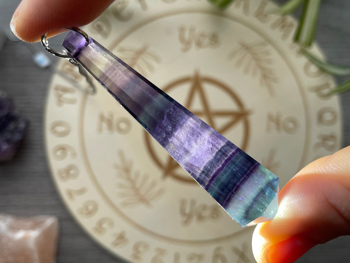 Rainbow Fluorite 8-Sided Crystal Pendulum (B) backlit