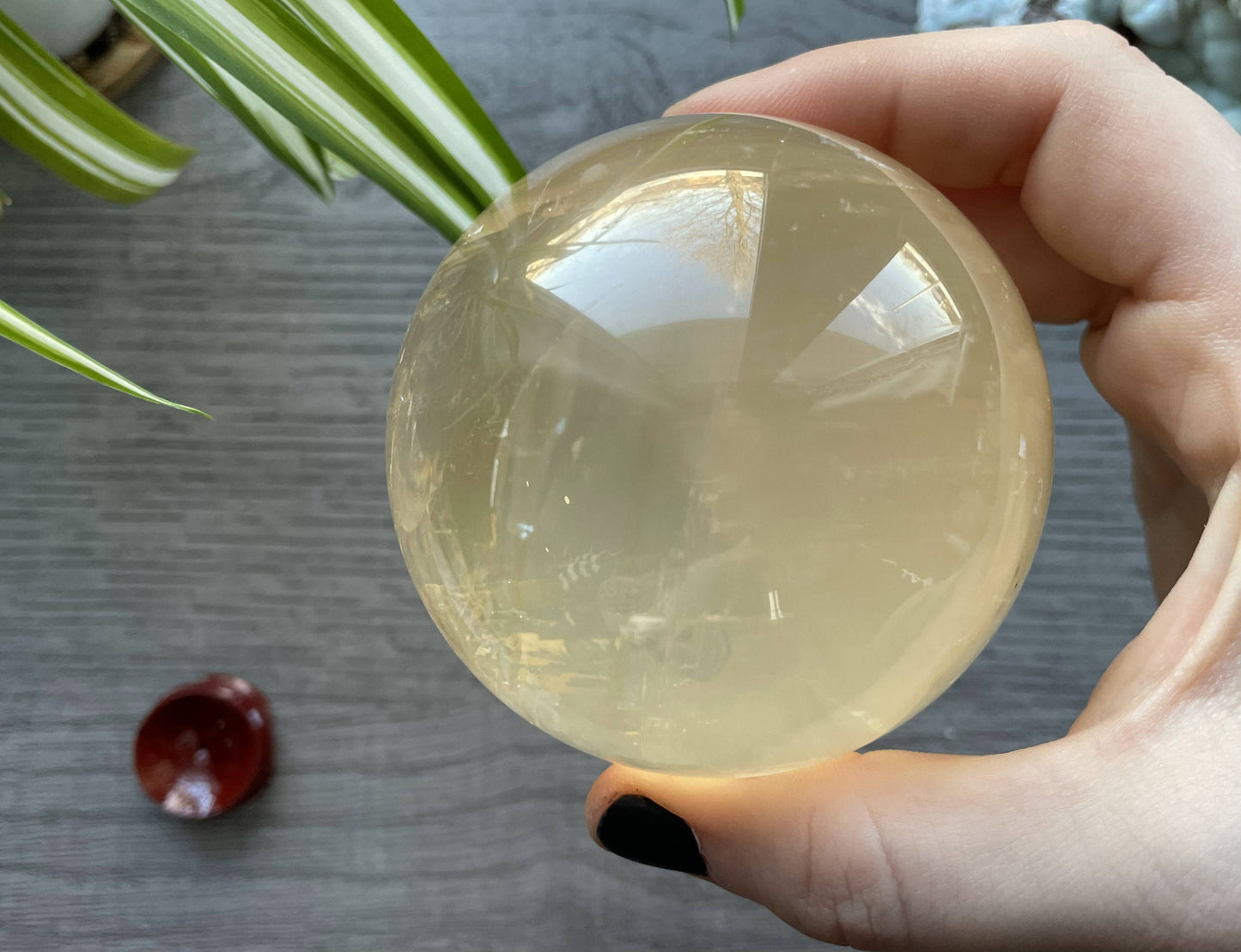 Honey Calcite Sphere - 70mm (H) - The Wandering Fox Emporium, Your Crystal Store side