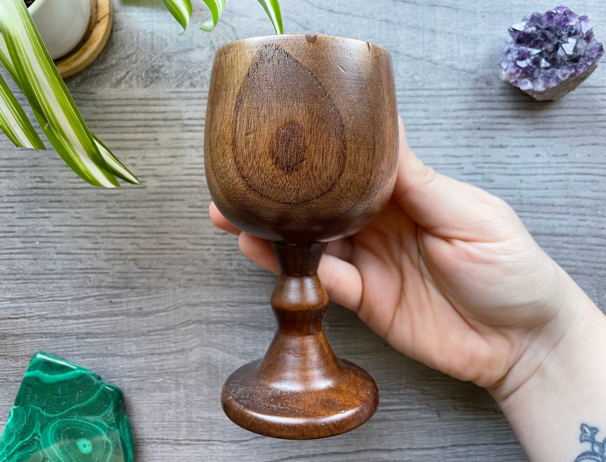 Pictured are various wood goblets with pentagrams on them.