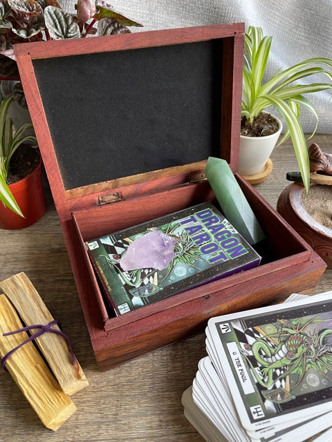 Pictured is hand-carved wood box with the "OM" symbol in the middle. OM Symbol Carved Wooden Box open