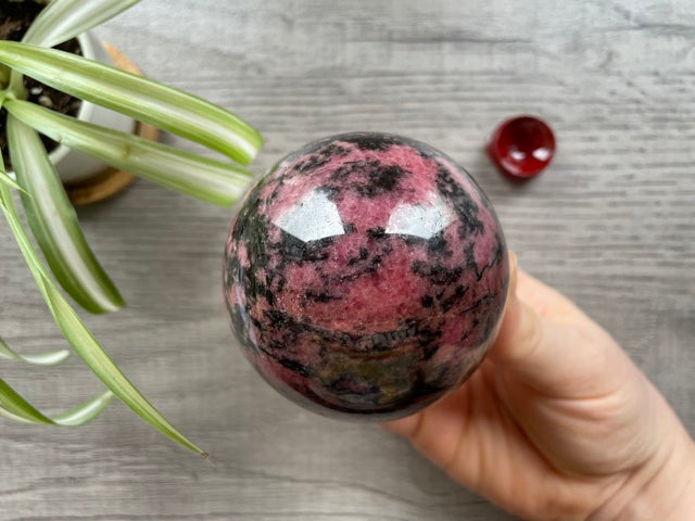Rhodonite Sphere 70mm - The Wandering Fox Emporium, Your Crystal Store