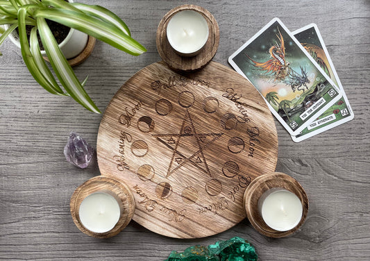 Pictured is a wood candle holder for three candles with a pentagram and the moon phases engraved on it. Moon Cycle Engraved Wooden Candle Holder close up