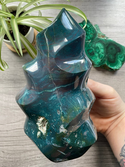 Pictured is a carved ocean jasper (river jasper) flame. Ocean Jasper Flame 1.35kg - The Wandering Fox Emporium, Your Crystal Store close up