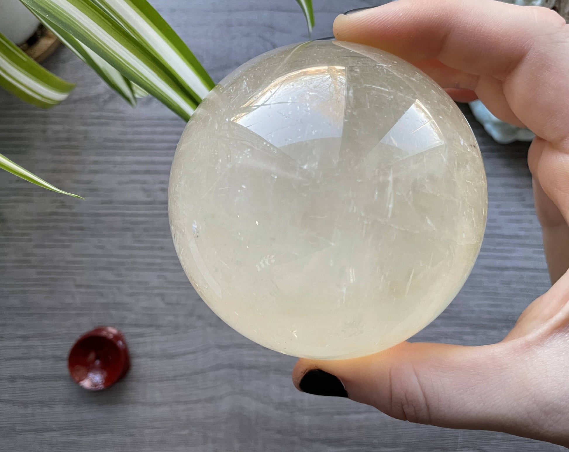 Honey Calcite Sphere - 79mm (G) - The Wandering Fox Emporium, Your Crystal Store side