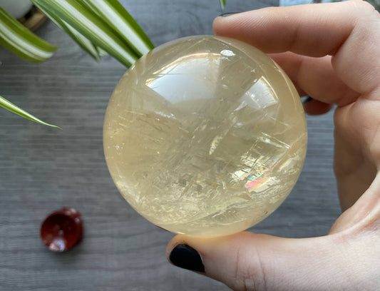Honey Calcite Sphere - 70mm (H) - The Wandering Fox Emporium, Your Crystal Store front