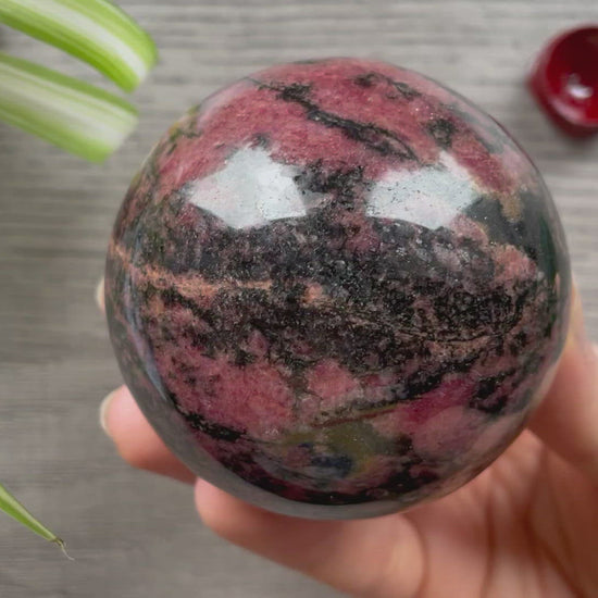 Rhodonite Sphere 70mm - The Wandering Fox Emporium, Your Crystal Store video