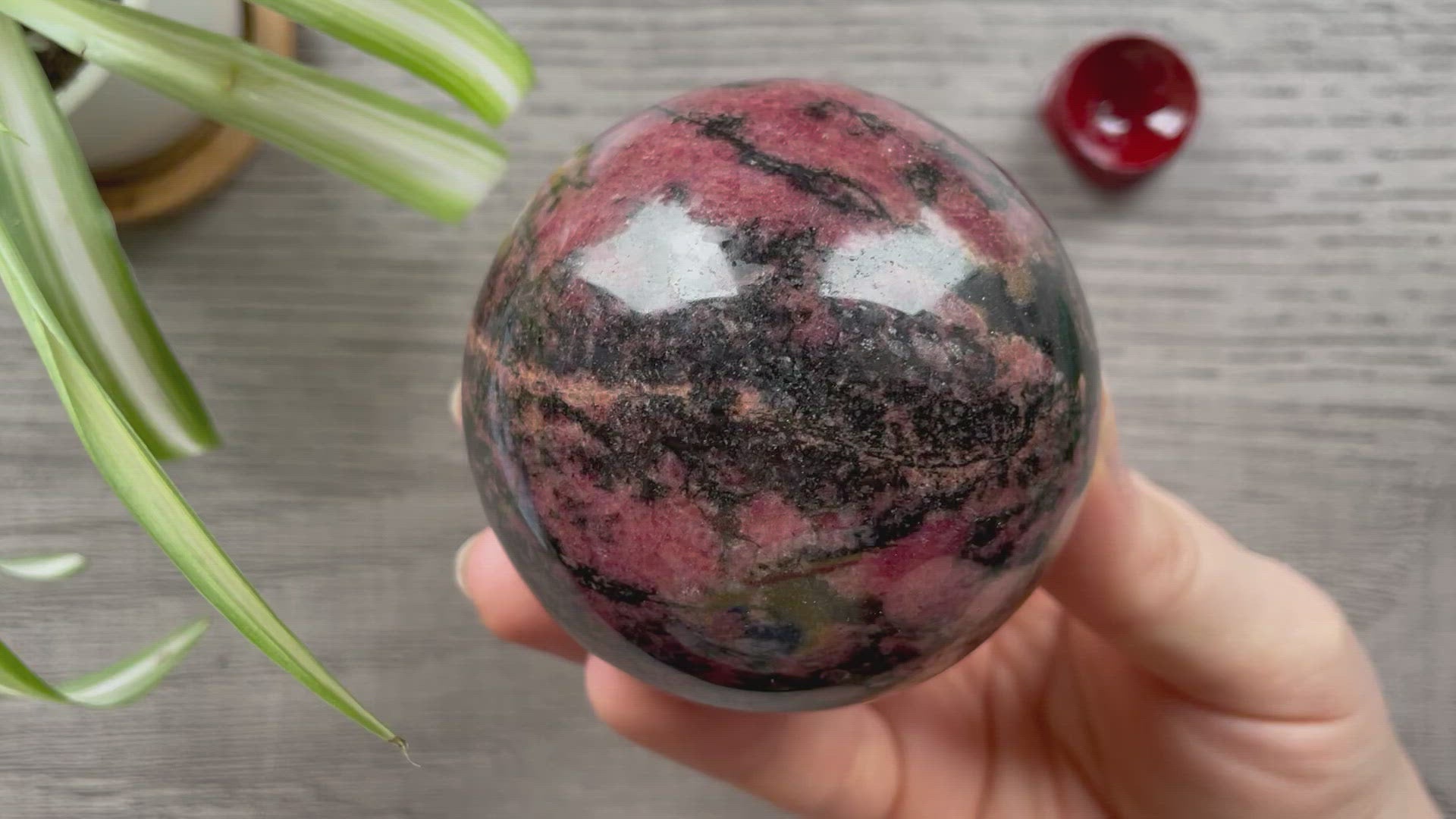 Rhodonite Sphere 70mm - The Wandering Fox Emporium, Your Crystal Store video