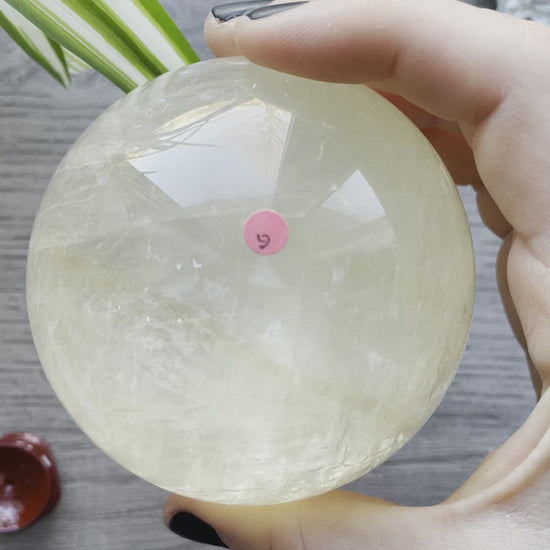Honey Calcite Sphere - 79mm (G) - The Wandering Fox Emporium, Your Crystal Store video